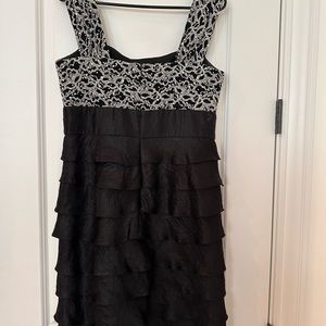 Black cocktail/wedding dress with ruffles and sequence.